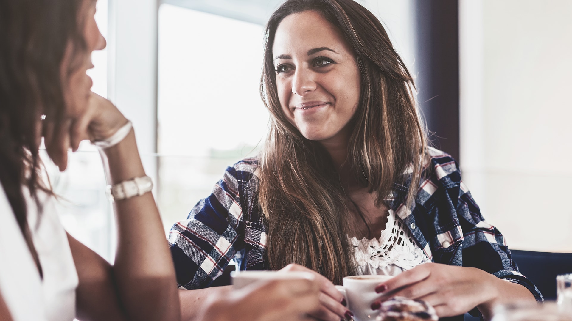 Two women having coffee.