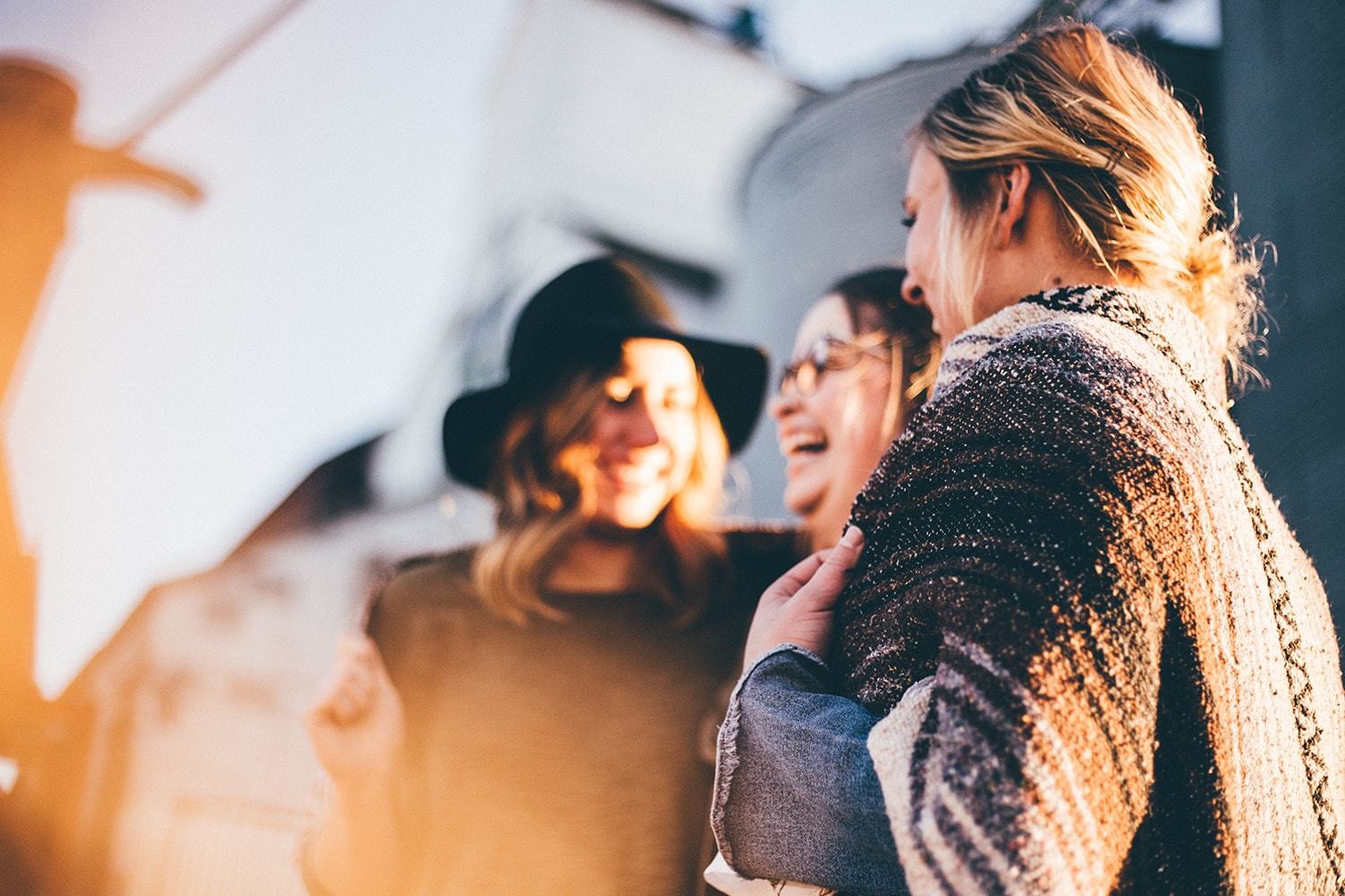 Group of women laughing together.