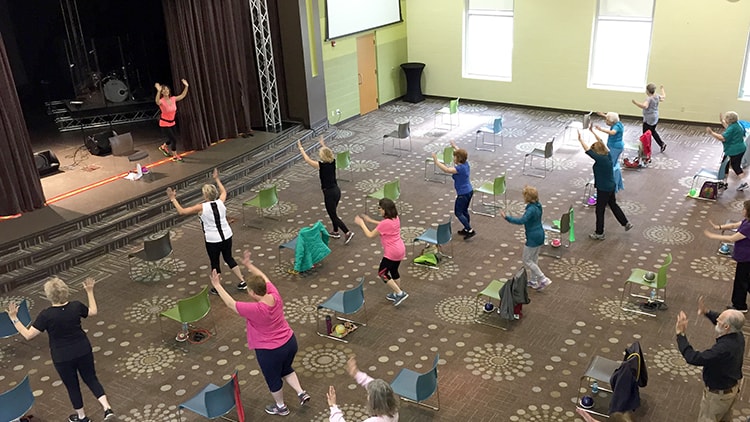 Senior adults enjoying a fitness class.